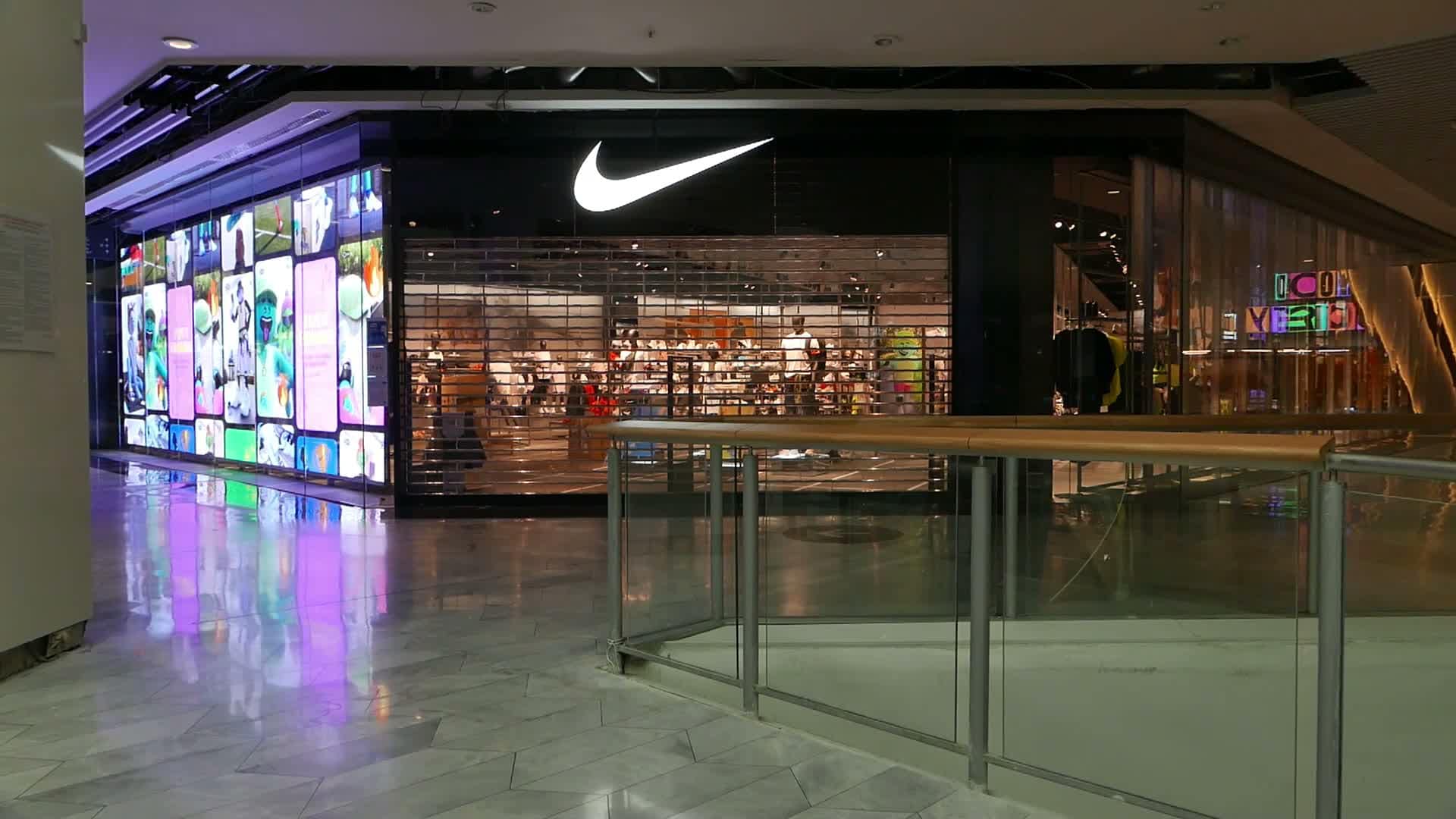 Transparent LED media wall running content on a glass retail frontage
